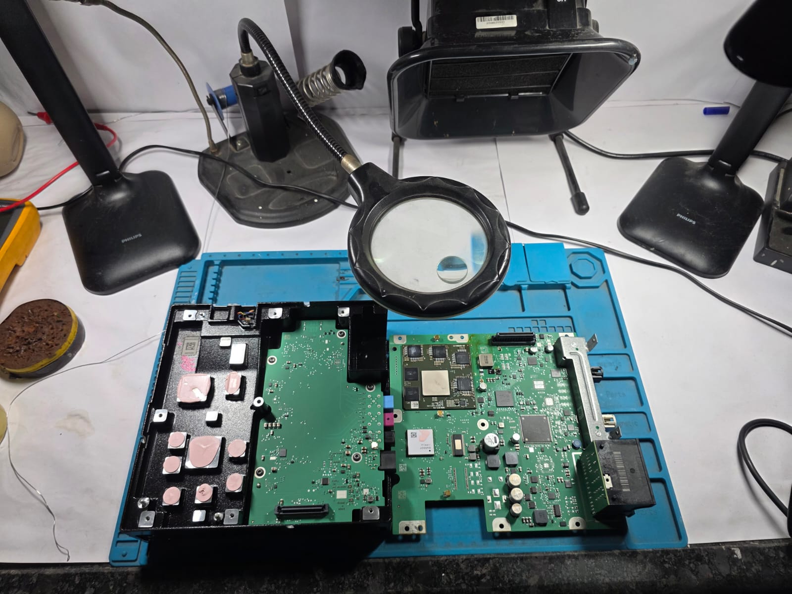 Circuit boards and inspection equipment on NAVFRAN's electronics workbench